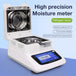 High precision moisture meter with halogen lamp and touch screen display on a blue background