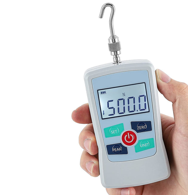 Digital force gauge held in a hand with a white background